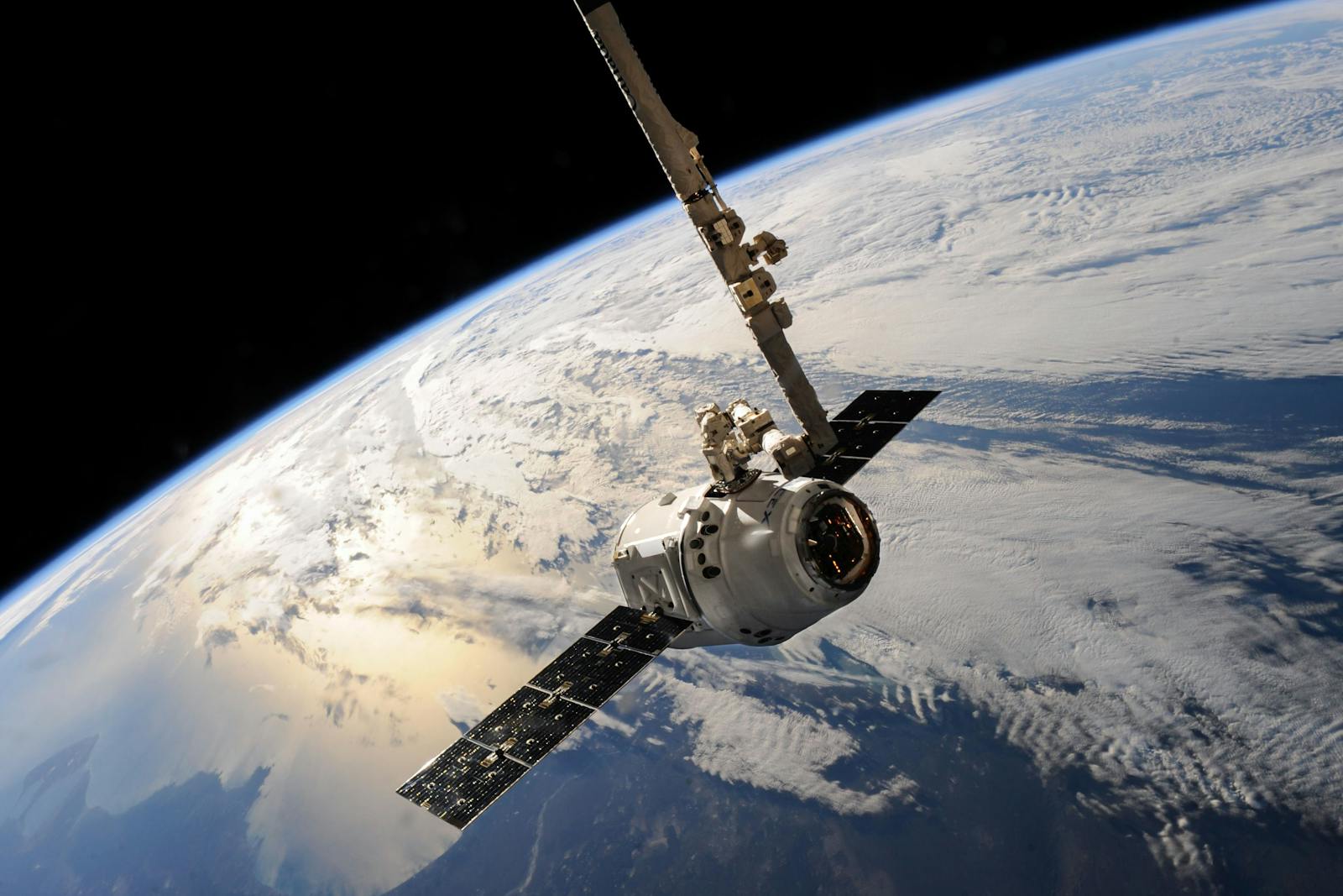 Each GPS satellite carries an atomic clock, and a relativistic correction baked into its firmware.